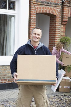 Removal van team preparing a move with safety checks and careful lifting