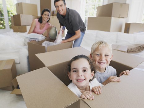 Moving van service loading packed boxes and furniture