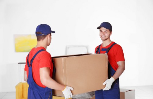 Removals team preparing a Kingston house move with boxes and furniture