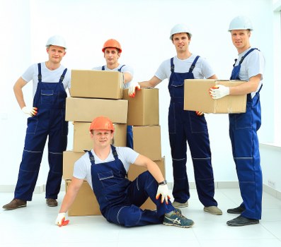 Local removals team handling furniture in Kingston