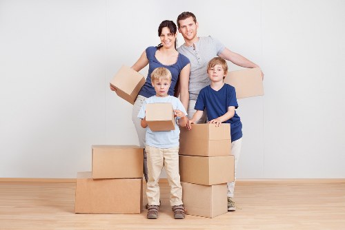 Trained movers handling furniture with care