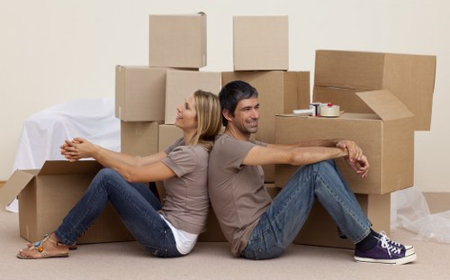 Careful loading of household items for a Kingston removal van job