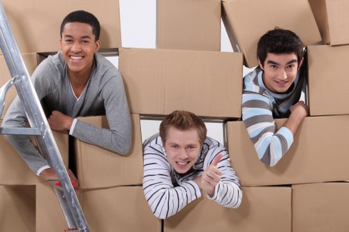 Local moving team organizing packed items for transport
