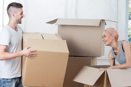 Loading furniture and boxes into a moving truck in Kingston