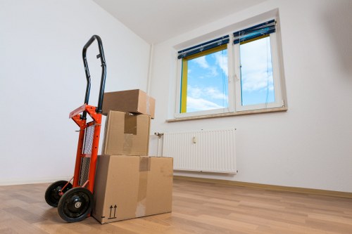 Packed boxes and furniture ready for student removals in Kingston